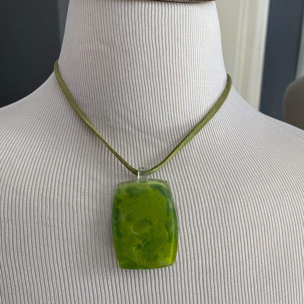 Green stone necklace on a leather band